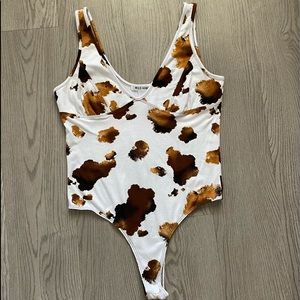 Wild honey cowprint bodysuit